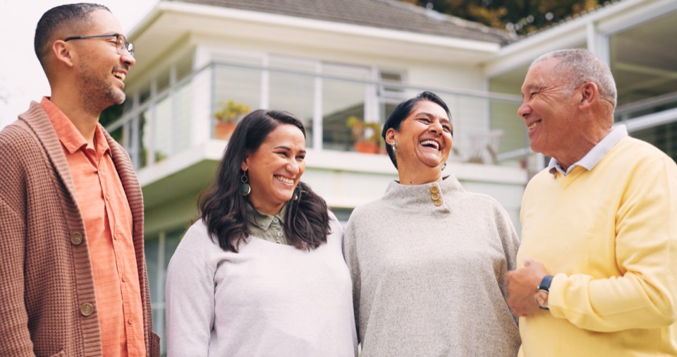 Homeowners together outside their home
