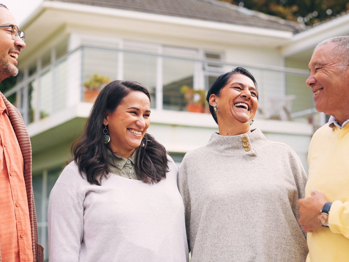 Homeowners outside their home